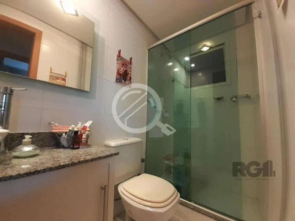 Imagem Apartamento de dois dormitórios sendo um suíte, living dois ambientes com churrasqueira, cozinha e...