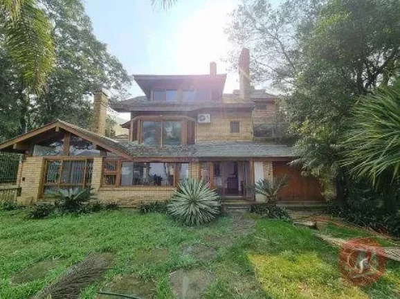 Foto do imóvel Casa com 3 dormitórios para alugar, 500 m² por R$ 19.884,00/mês - Pedra Redonda - Porto Alegre/RS