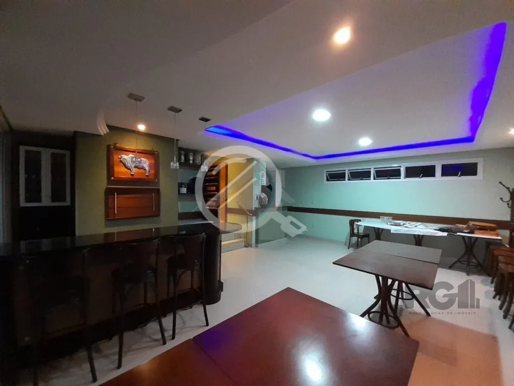 Imagem Apartamento de dois dormitórios sendo um suíte, living dois ambientes com churrasqueira, cozinha e...