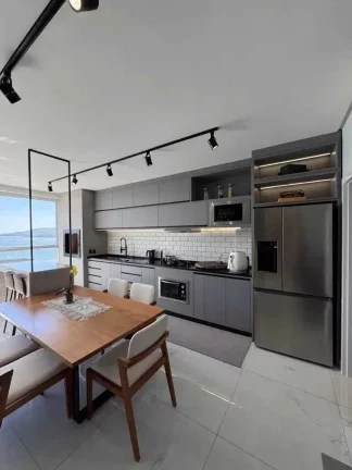 Imagem Apartamento vista mar com 2 suítes e 3 vagas de garagem em Balneário Perequê