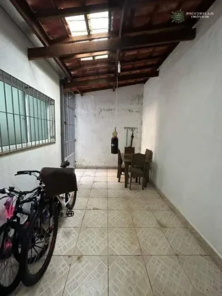 Imagem Sobrado com 3 dormitórios à venda, 125 m² por R$ 650.000 - Caiçara - Praia Grande/SP