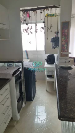 Imagem 1 dormitórios, sala para 2 ambientes com sacada, cozinha com armários planejados, banheiro social e área de serviço
