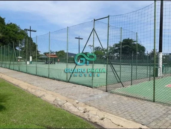 Imagem 3 dormitórios, 1 suíte com closet, pequena vista para o mar, sala para dois ambientes, varanda com vista para área verde, cozinha americana