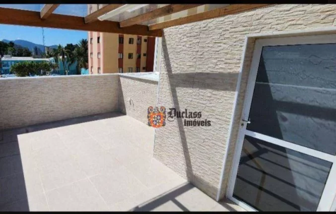 Imagem Sobrado triplex com 2 suítes à venda, 199 m² por R$ 675.000 - Massaguaçu - Caraguatatuba/SP