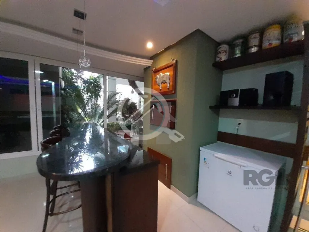 Imagem Apartamento de dois dormitórios sendo um suíte, living dois ambientes com churrasqueira, cozinha e...