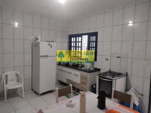 Imagem Casa à venda em Caraguatatuba-SP, bairro Rio do Ouro: 2 quartos, 2 salas, 2 banheiros, 2 vagas de garagem, 127m² - com piscina e churrasqueira!