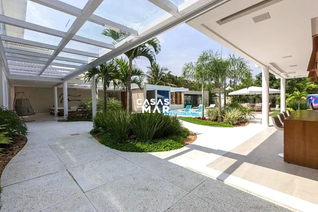 Imagem Imponente mansão de luxo na Barra da Tijúca: 5 quartos, 4 suítes, 3 salas, 7 banheiros, 2 vagas de garagem, 920m² de área. Venda!