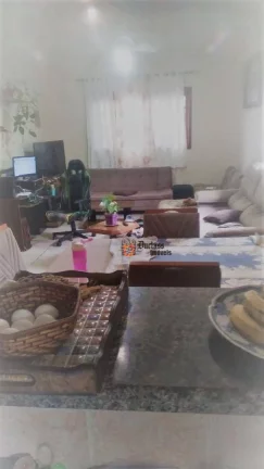 Imagem Casa com 3 dormitórios à venda, 135 m² por R$ 600.000 - Maracanã - Praia Grande/SP