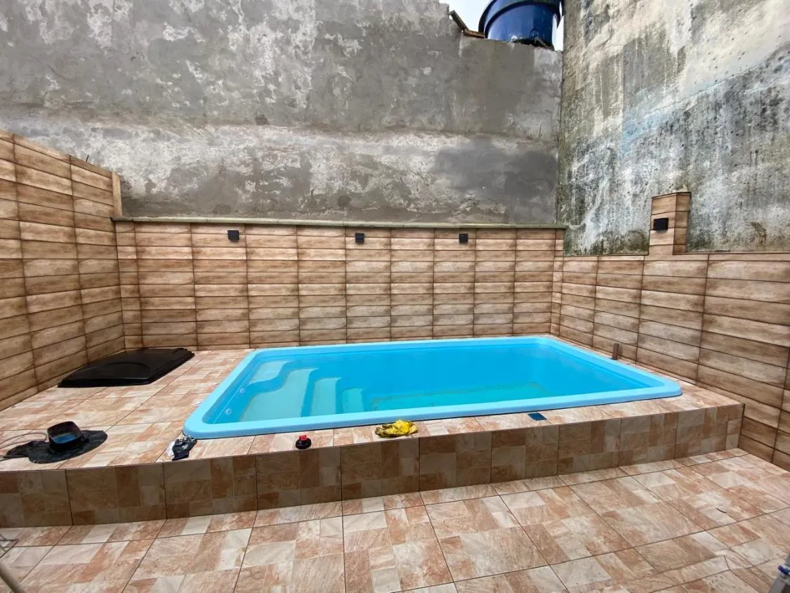 Imagem CASA NOVA COM PISCINA E ACEITA FINANCIAMENTO BANCÁRIO NO JARDIM JAMAICA EM ITANHAÉM