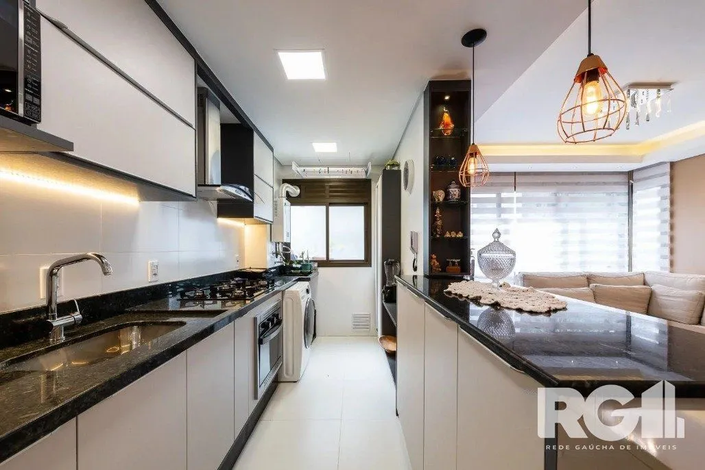 Imagem Apartamento de 3 dormitórios com suíte e churrasqueira, lavabo e 2 vagas de garagem.