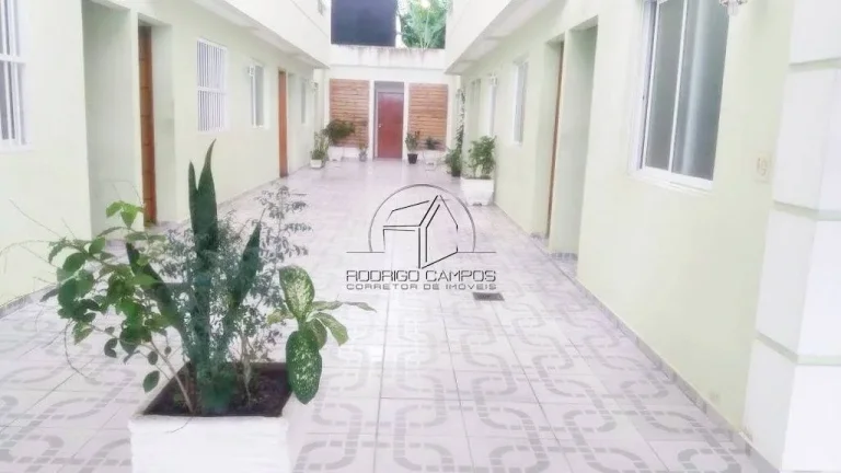Imagem Casa Geminada à Venda em Tude Bastos, Praia Grande - 2 Quartos e Churrasqueira