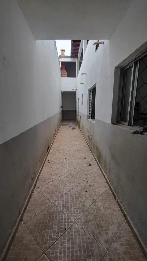 Imagem Sobrado com 4 Dormitórios e Terraço Gourmet em Localização Privilegiada