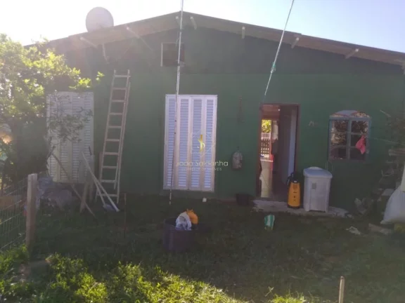 Imagem Casa para Venda em Guaratuba, rua asfaltada, próximo ao mar.