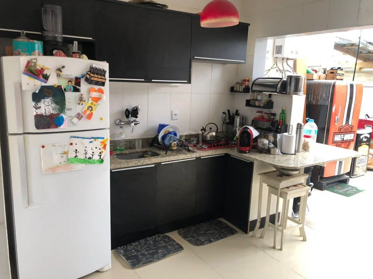 Imagem Casa com 3 dormitórios 2 suítes, área gourmet, vaga de estacionamento, Guarujá, Porto Alegre RS