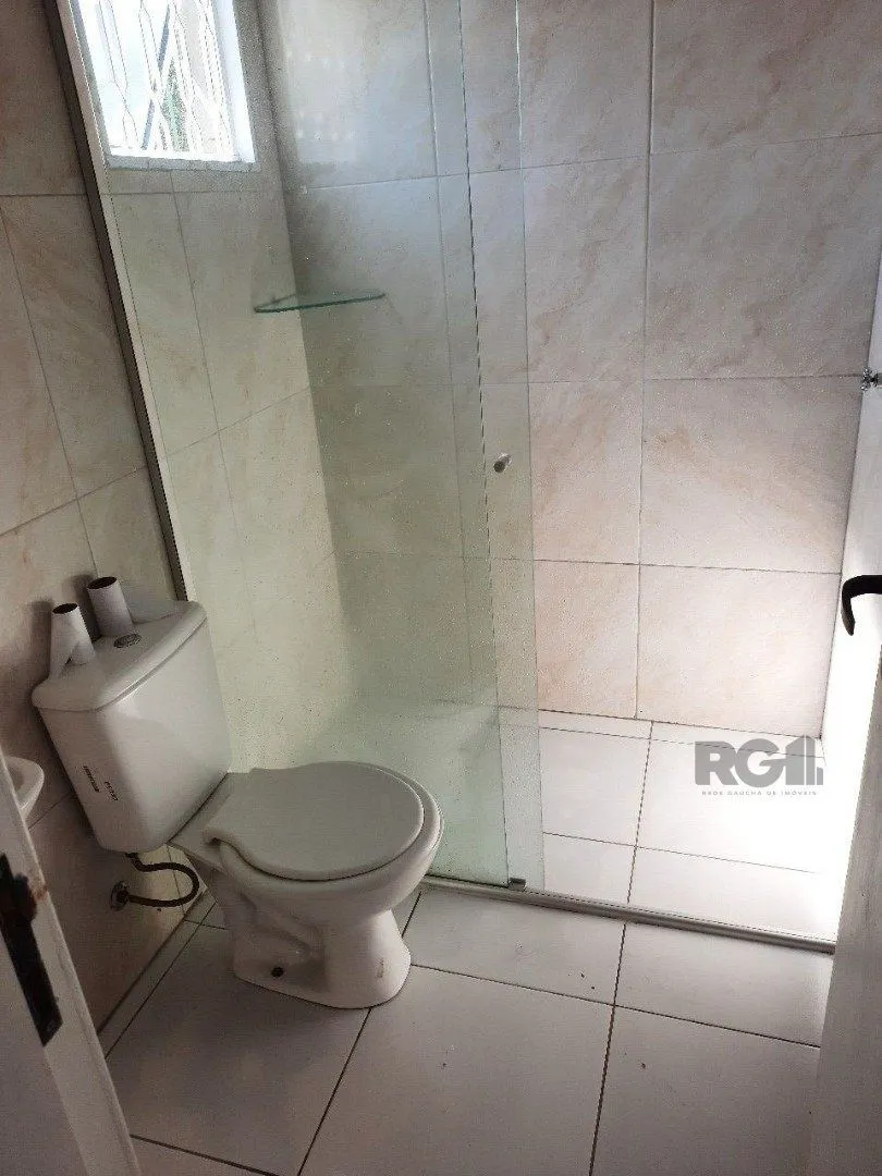 Imagem Oportunidade Imperdível: Prédio com 4 Apartamentos, Pátio e 2 Vagas de Garagem
