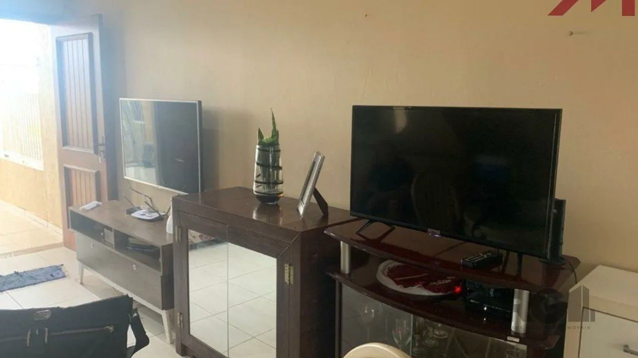 Imagem Sobrado em Trmandai com 2 suirtes, 2 banheiros, 1 vaga, churrasqueira e varanda.