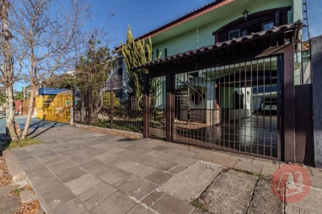 Foto do imóvel Casa com 5 dormitórios para alugar, 270 m² por R$ 7.222,00/mês - Partenon - Porto Alegre/RS