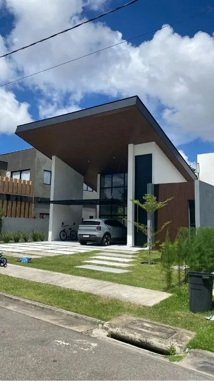 Casa de luxo no Alphaville Paraíba com 5 suítes, área gourmet integrada, escritório, jardins e lazer completo.