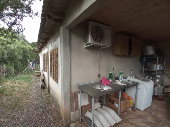 Imagem Sítio com Casa em condomínio Fechado, Próximo da portaria, junto a RS040