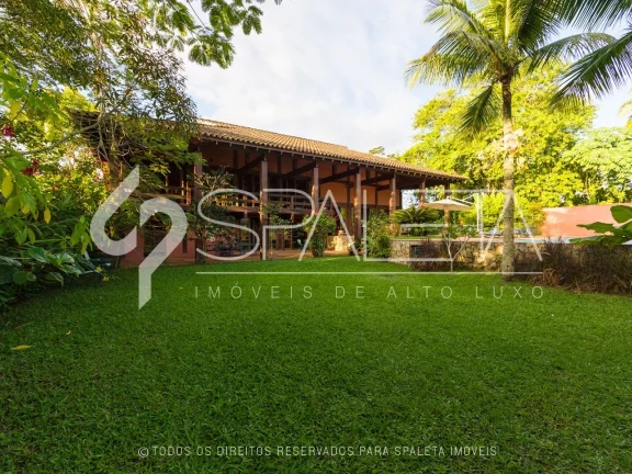 Imagem Lindíssima residência com golfe no quintal e vista sensacional para o lago à venda no Guarujá Golf Club