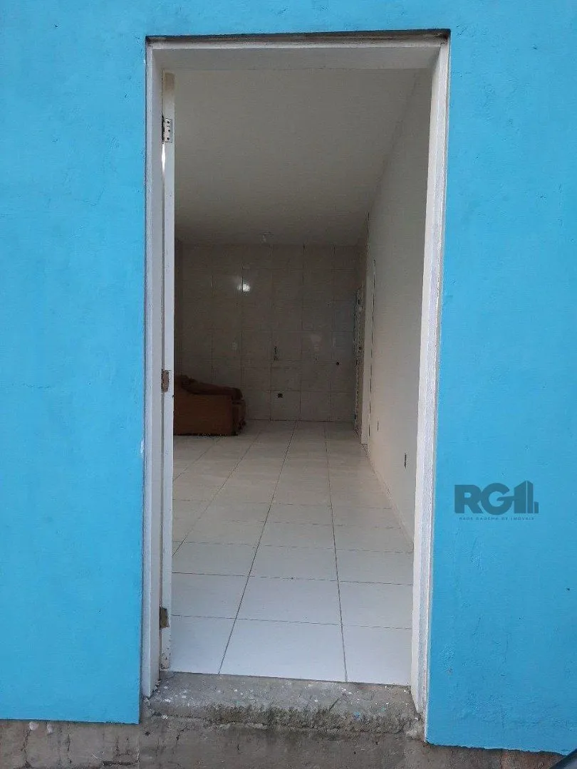 Imagem Oportunidade Imperdível: Prédio com 4 Apartamentos, Pátio e 2 Vagas de Garagem