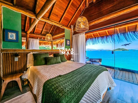 Imagem Casa de Luxo à Beira Mar em Angra dos Reis: 6 Suítes, 7 Salas, 950m² - Piscina, Churrasqueira e Deck Privativo