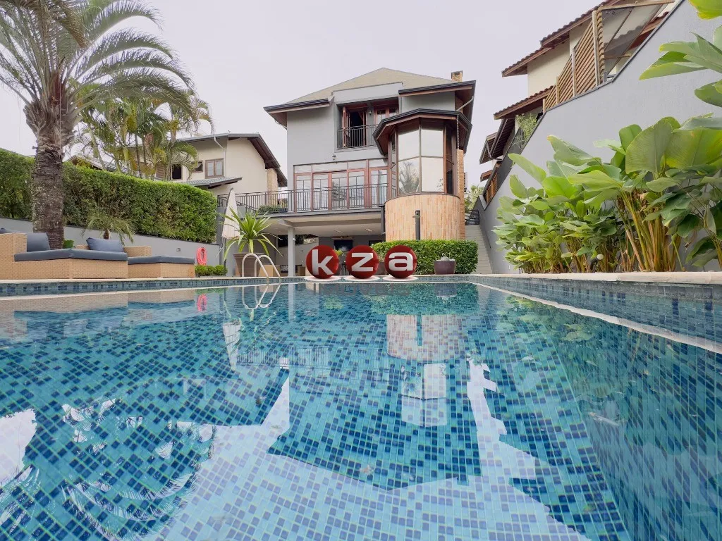 Foto do imóvel Casa de luxo a venda no Condomínio Reserva Colonial em Valinhos: 3 suítes + 1, 4 salas e amplo espaço gourmet com piscina.