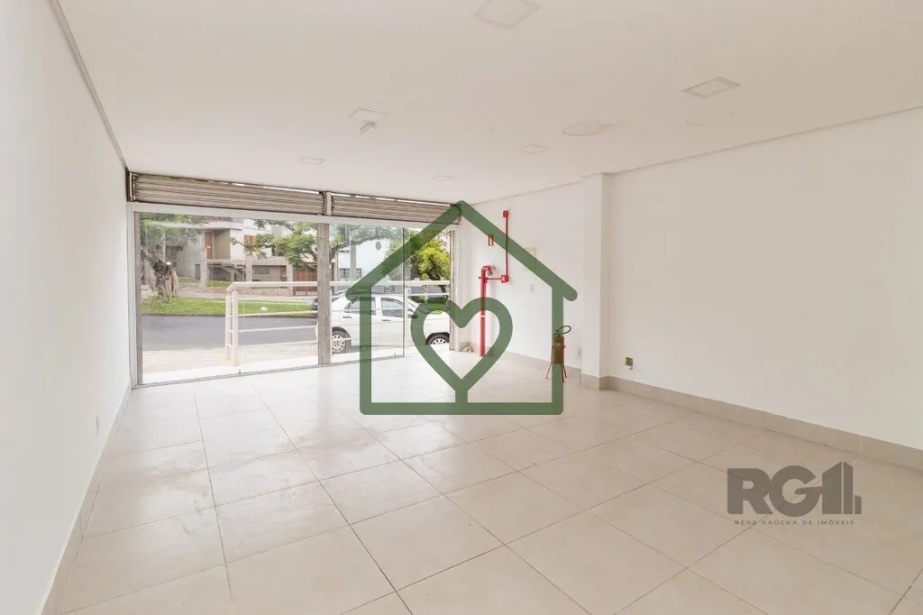 Loja localizada no bairro Jardim Itu SabarÃ¡, com 48mÂ². ImÃ³vel com banheiro social e pisos em cerÃ...