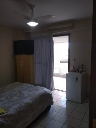 Imagem De frente para o mar da Praia do Morro 3 quartos sendo uma suíte +DCE duas vagas de garagem. Prédio com área de lazer