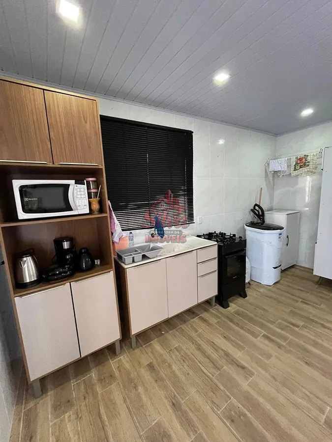 Imagem Casa 2 dormitórios com suíte a 580m do mar no Mariluz