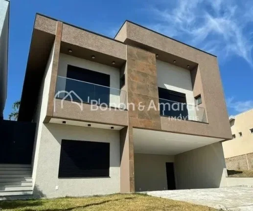 Imagem Lindo sobrado com 4 suítes, sendo uma master com jardim de inverno, outra no térreo, varanda. Espa...