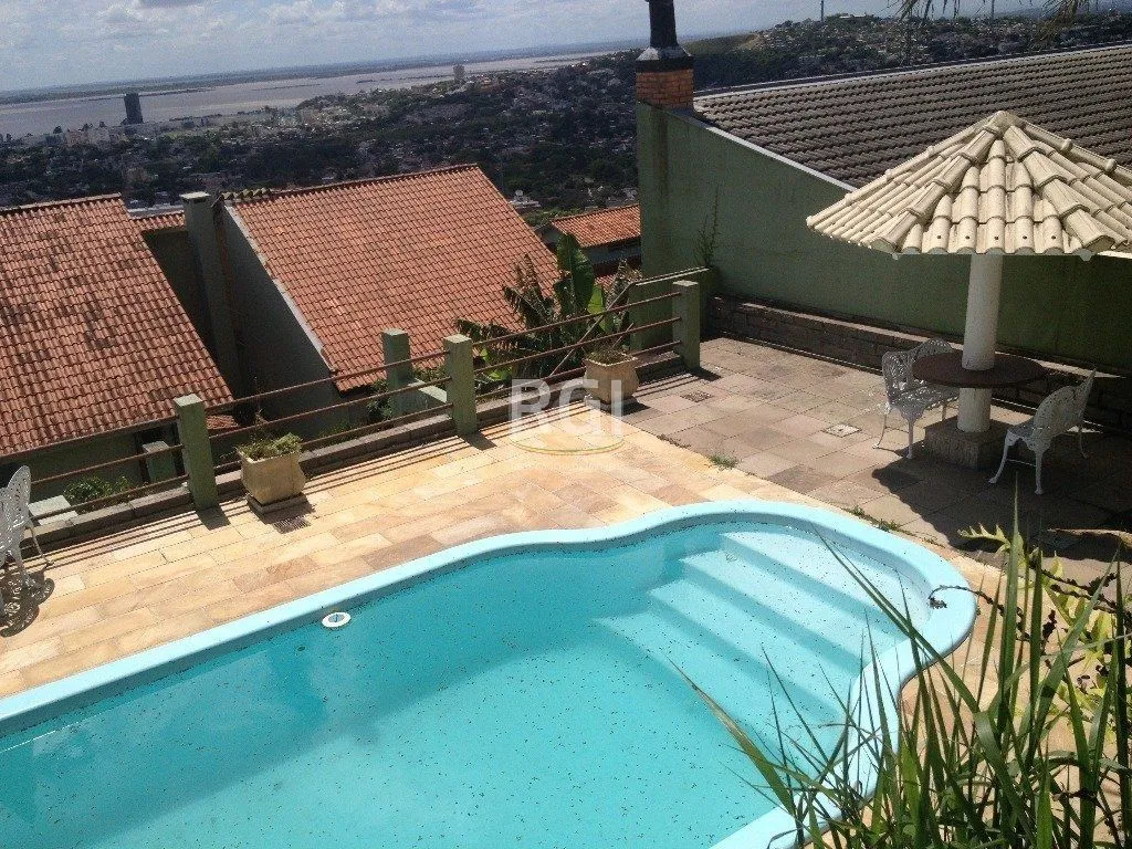 Imagem Casa Condominio para Venda - 350m², 4 dormitórios, sendo 1 suites, 2 vagas - Nonoai