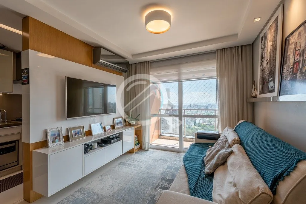 Imagem Ótimo apartamento em andar alto com linda vista perene do Rio Guaíba. Imóvel com 76,69 m2 de áre...