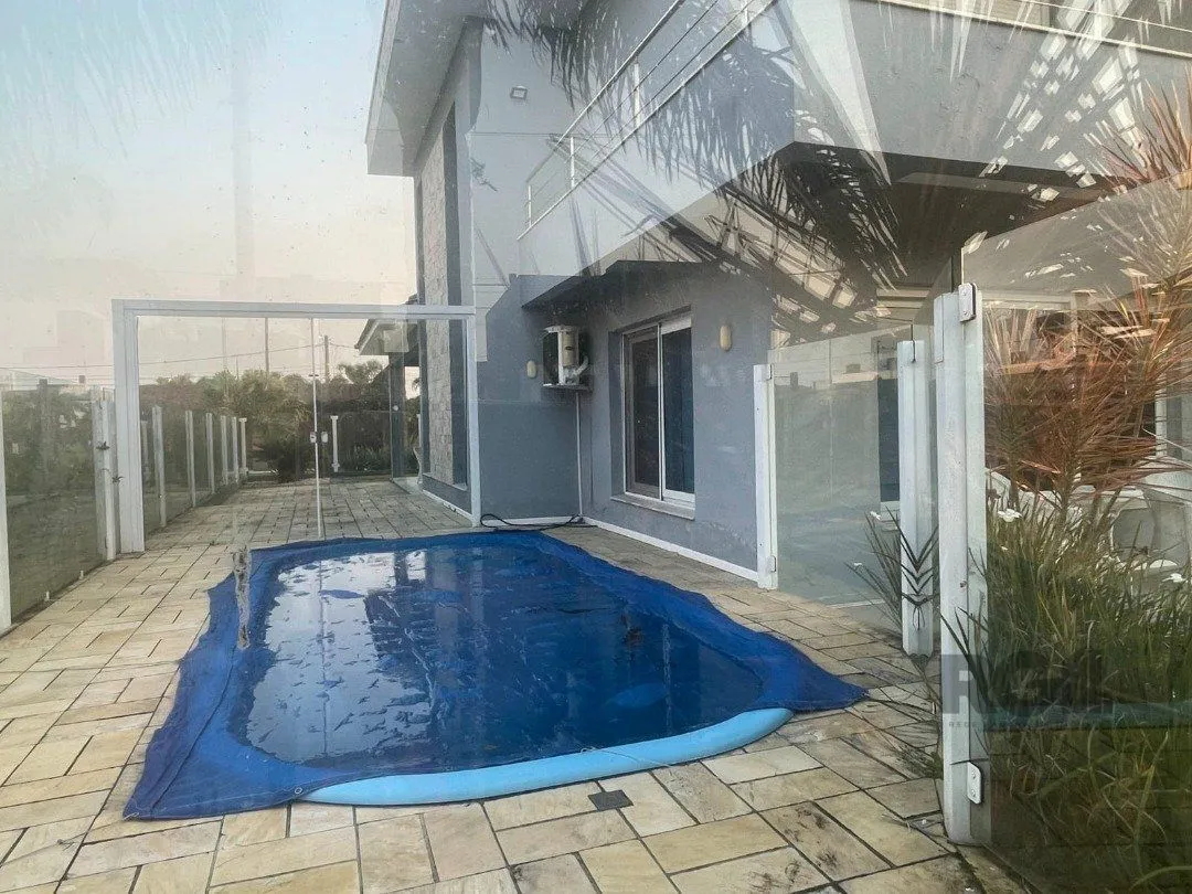 Imagem Casa de Condomínio em Atlântida Sul
