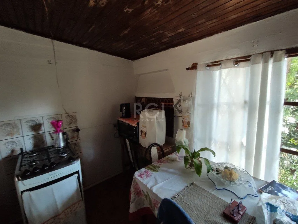 Imagem Casa para Venda - 134m², 2 dormitórios, 1 vaga - Nonoai
