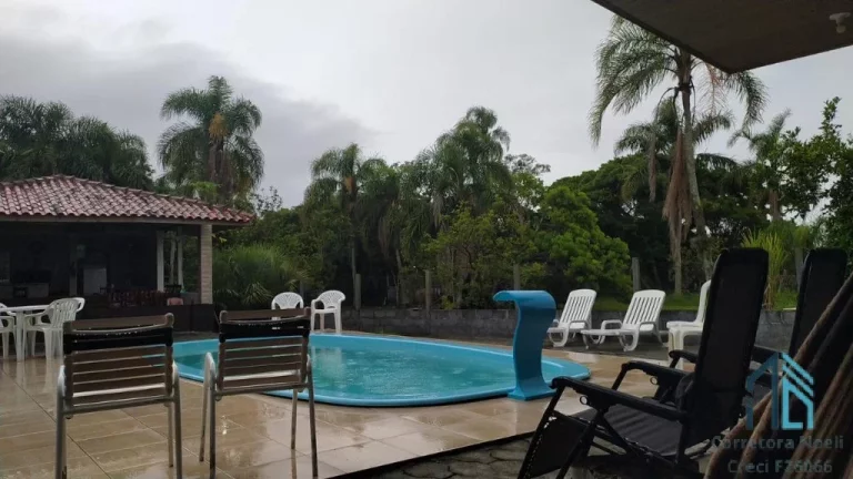 Foto do imóvel Sítio/Fazenda a venda 12 hectares, casa com piscina, ótimo investimento em Laguna SC