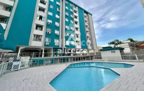 Imagem AP. 2 dormitórios, semi mobiliado, com sacada, elevador e piscina em Barreiros - São José - SC