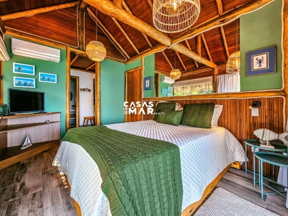 Imagem Casa de Luxo à Beira Mar em Angra dos Reis: 6 Suítes, 7 Salas, 950m² - Piscina, Churrasqueira e Deck Privativo