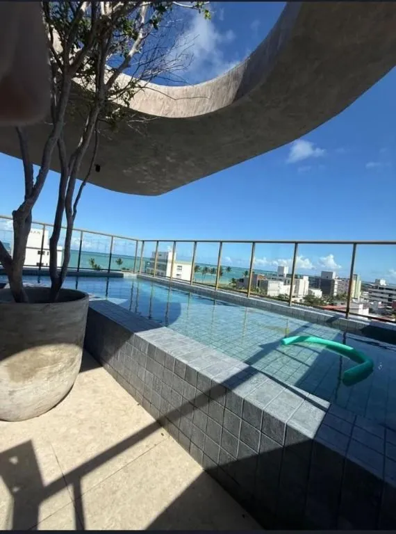 Imagem Flat novo em Camboinha, a 1 rua do mar, com rooftop e alto potencial para Airbnb. Ideal para investir ou morar.