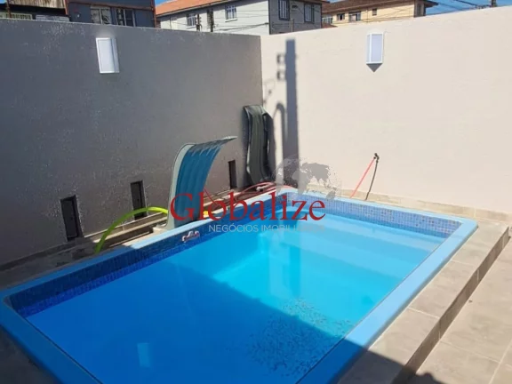 Foto do imóvel Sobrado triplex à venda com 94m², 2 suítes, piscina e vaga por R$588.905,00 em Santos