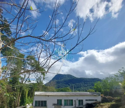Imagem Terreno com casa e chalé construído à venda em Ubatumirim - Ubatuba/SP.