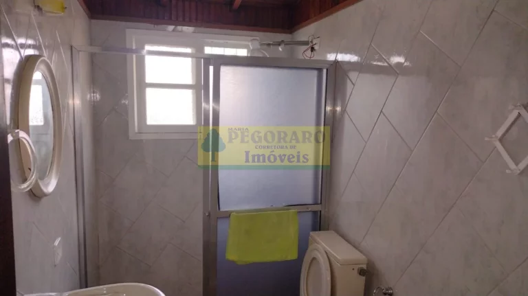 Imagem Imperdível Casa de 4 Quartos na Prainha, Caraguatatuba-SP: 2 Suítes, 2 Salas, 4 Banheiros, 4 Vagas de Garagem!