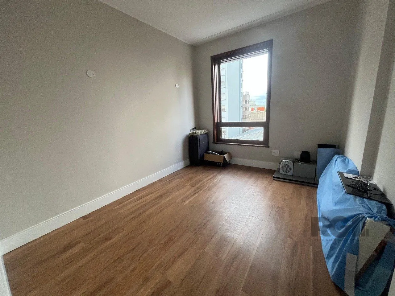 Imagem Apartamento de três quartos, suíte e uma vaga de garagem no bairro Independência em Porto Alegre.