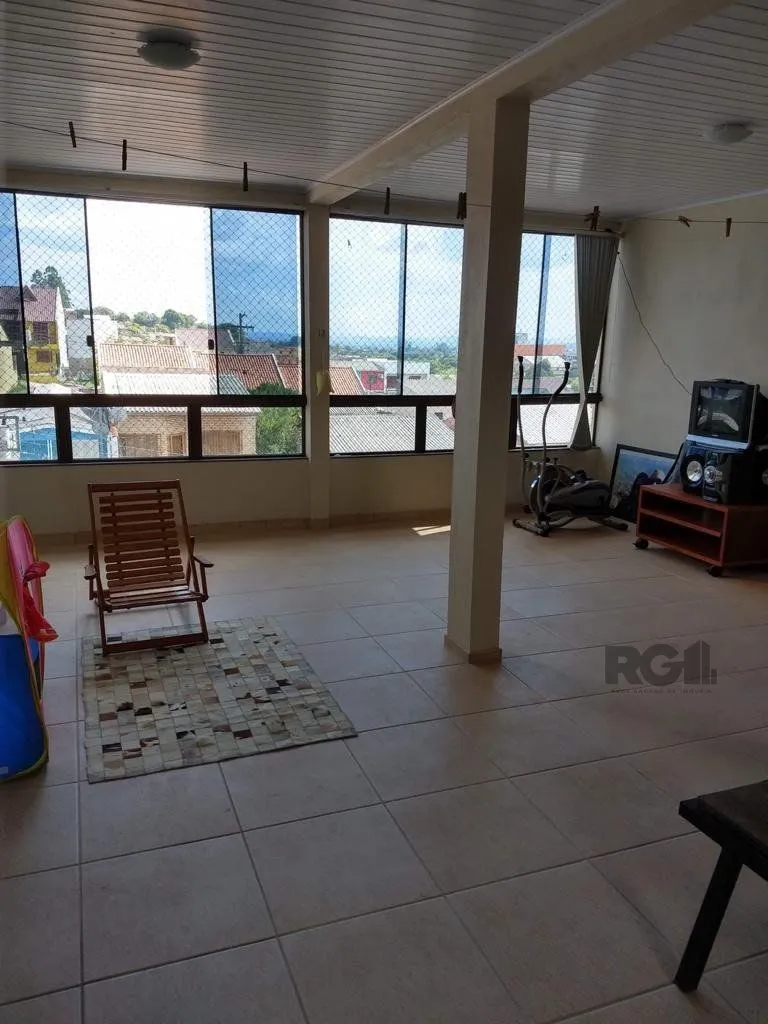 Imagem Casa 3 quartos, 4 vagas, salão de festa, sacada 198m² bairro Rubem Berta, Poa/RS