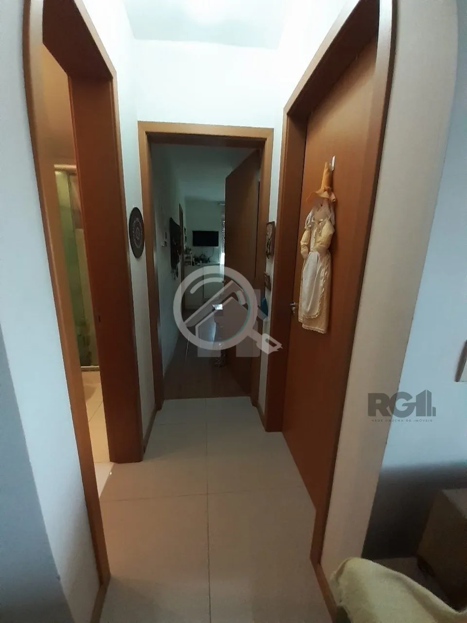 Imagem Apartamento de dois dormitórios sendo um suíte, living dois ambientes com churrasqueira, cozinha e...