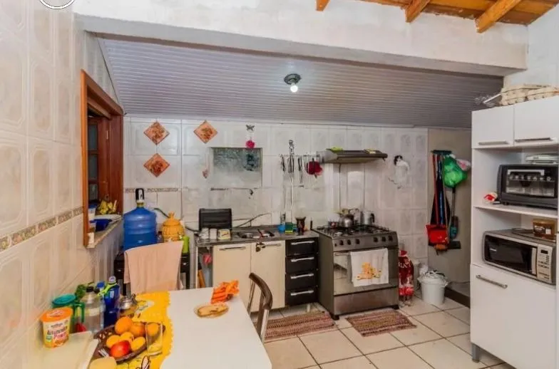 Imagem Casa de 3 dormitórios , com suíte , banheiro social , 2 apartamentos de 1 dormitório nos fundos ,vaga para 3 carros !