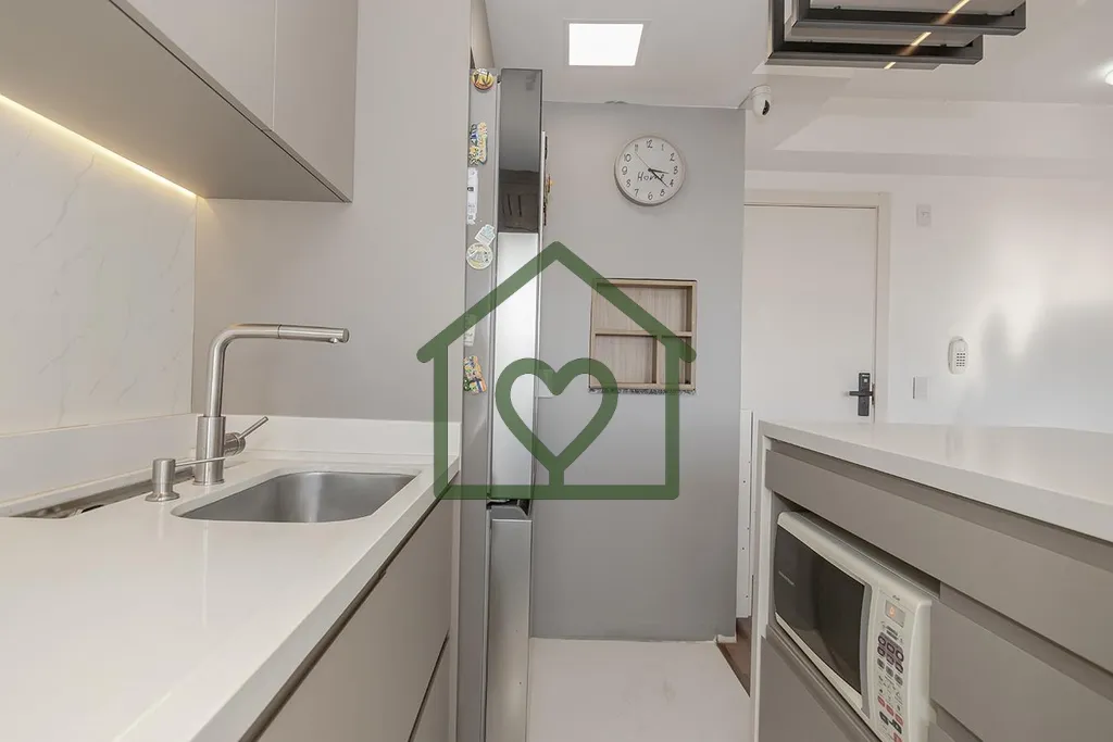 Imagem Este apartamento com living estendido se destaca pela perfeita integração dos ambientes, acabament...