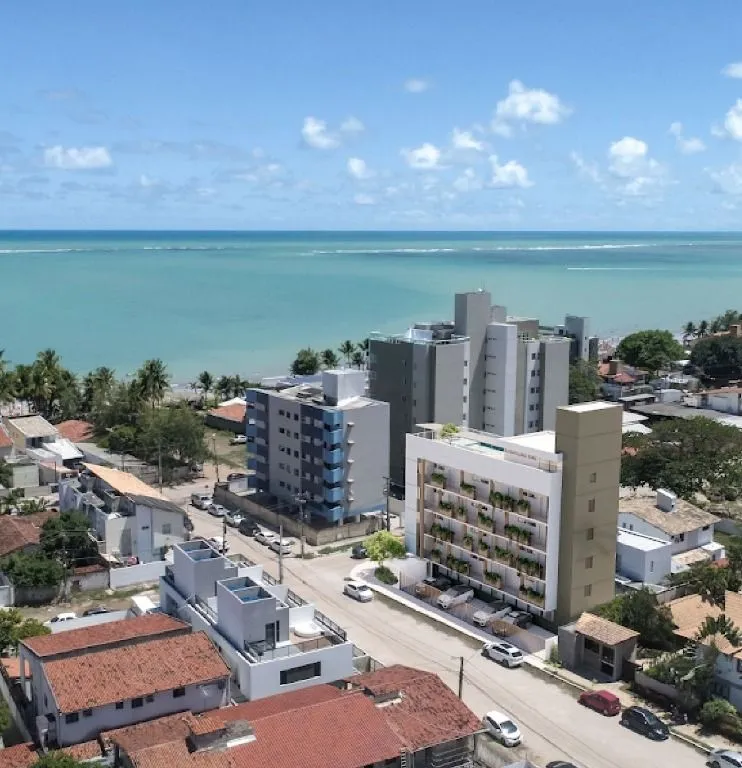 Imagem Flat novo em Camboinha, a 1 rua do mar, com rooftop e alto potencial para Airbnb. Ideal para investir ou morar.