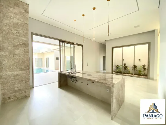 Imagem Casa de alto padrão com 3 suítes, cozinha gourmet e piscina com cascata