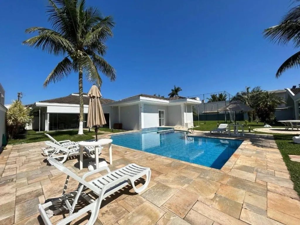Imagem Alugar casa em condomínio em Jardim Acapulco Guarujá SP, casa á venda em Guarujá SP